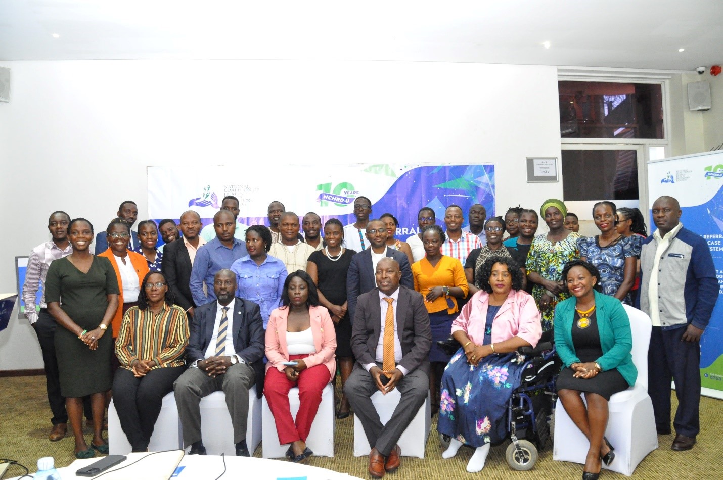 Mr. Hassan Shire the ED of Defend Defenders Pause for a picture with HRDs after the launch of the system at Skyz Hotel Naguru on 9th May 2024