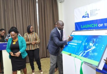 NCHRD-U Executive Director Mr. Robert Kirenga signing on the dummy screen during the launch